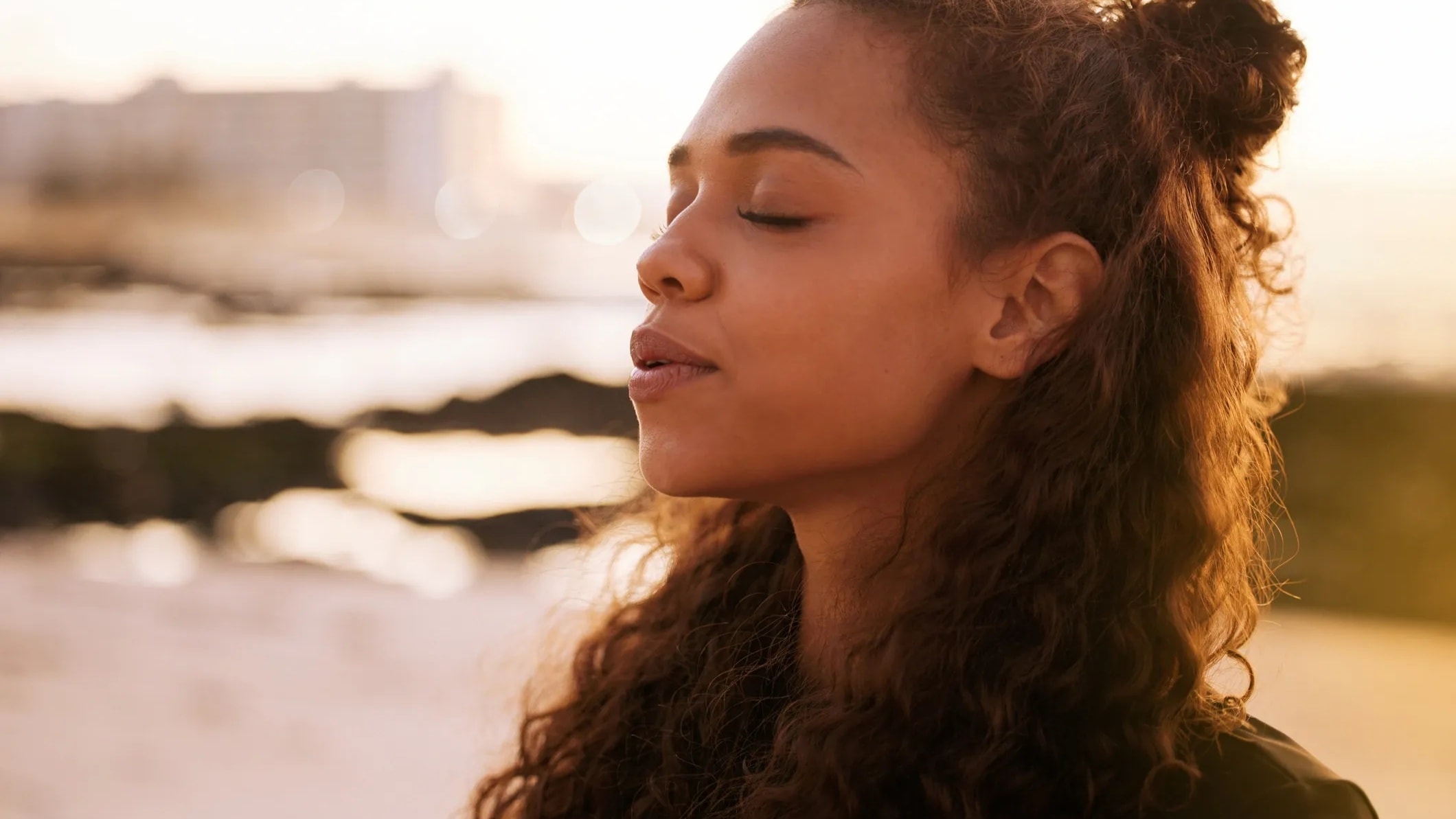 Woman in peaceful meditation outdoors